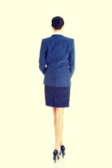 Fototapeta premium Rear view of young beautiful businesswoman