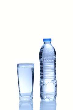 Water in plastic bottle with glass