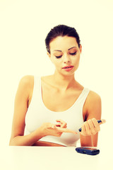 Diabetes patient measuring glucose level blood test