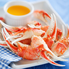 Boiled crab claws with orange sauce, selective focus - obrazy, fototapety, plakaty