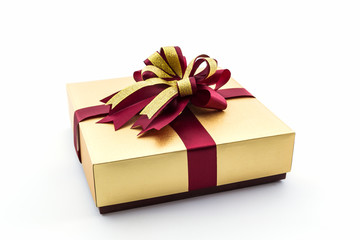 Gold and brown gift box with ribbon bow.