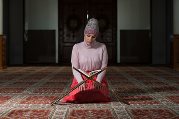 Muslim Woman Is Reading The Koran