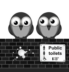 Monochrome comical toilet sign on brick wall