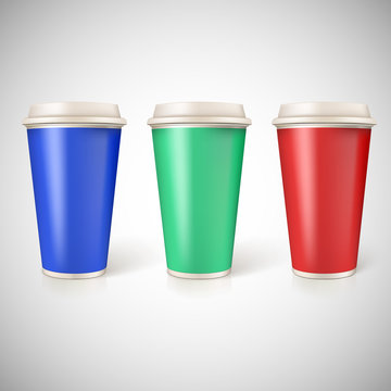 Disposable cups for coffee, closeup with multicolored labels.