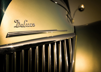 deluxe hood badge on a retro vehicle