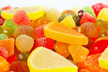 Fototapeta na wymiar Colorful fruity candies and jujube close up