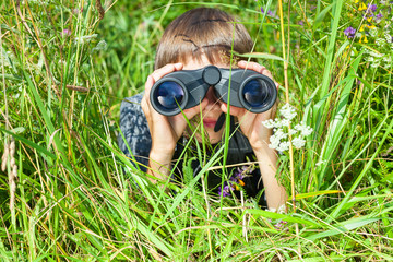 Child looking through binoculars