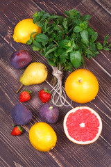 Grapefruits, pears, lemons, figs, strawberry, pomelo; still life