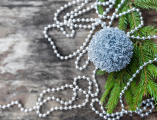 Silver Christmas ball on wooden background