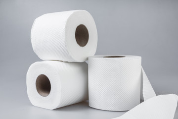 Stack of white tissue paper rolls.