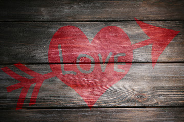 Love concept. Inscription on wooden wall background