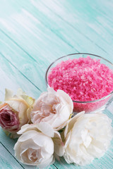 Sea salt in bowl with roses