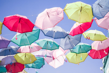 many  colorfull umbrellas on sky