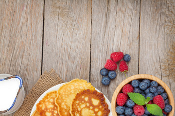 Pancakes with raspberry, blueberry and milk