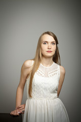 Young woman in white.