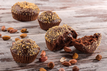 Close-up picture of chocolate cupcake with almonds and hazelnut