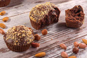 Close-up picture of chocolate cupcake with almonds and hazelnut