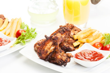 Chicken wings with fries french and spicy sauce
