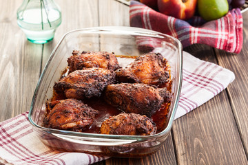 Roasted chicken drumsticks in casserole dish