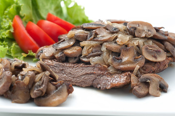 Fried beef with mushrooms and fresh tomatoes