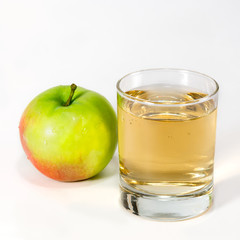 Glass with juice and apple