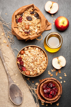 Granola, dried berries, nuts, apples and honey. See series