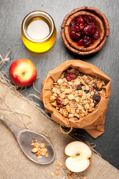 Granola, dried berries, apples and honey. Fitness breakfast