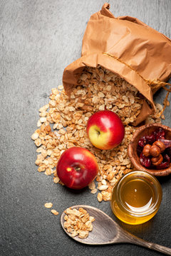Granola, honey, nuts and fresh apples. Fitness breakfast