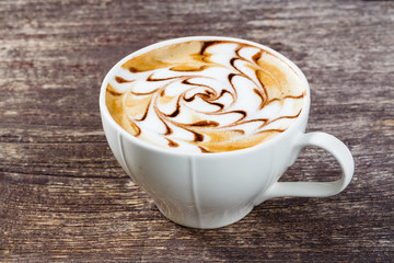Cup of coffee on old wooden table