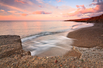 Sunset on a beach in Crete, Greece.