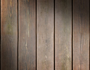 Weathered wooden plank background lit diagonally