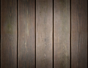 Weathered wooden plank background with dark edges