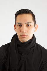 Obraz premium Hispanic man in black turtle neck, looking serous