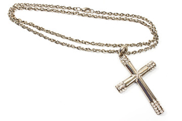 Fototapeta na wymiar Silver christian cross necklace isolated on white