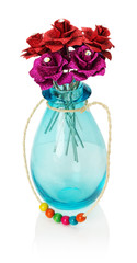 artificial roses in a glass vase isolated on the white backgroun