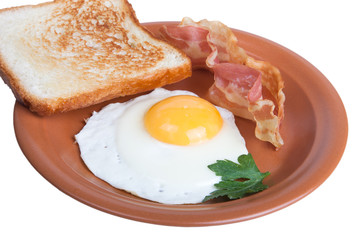 Fried eggs with bacon and bread isolated on white background