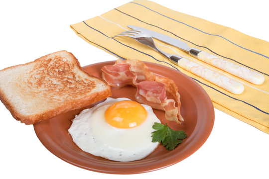 Fried Eggs With Bacon And Bread Isolated On White Background