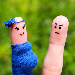 Face painted on fingers. man was upset because woman is pregnant