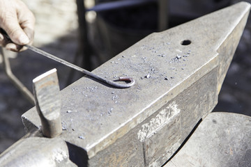 Hammer and anvil to forge