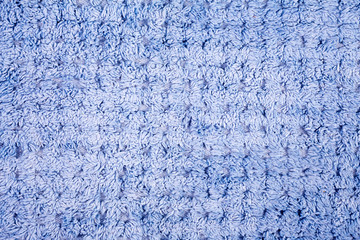blue wool knitting pattern close up