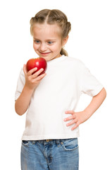 little girl with fruits and vegetables on white