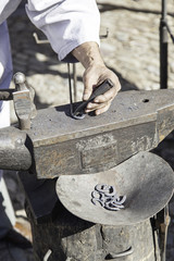 Hammer and anvil to forge