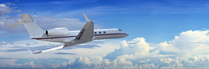 Corporate jet cruising in a cloudy sky