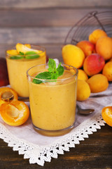 Apricot dessert in glasses on table close-up