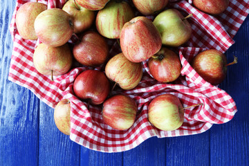 Juicy apples on wooden table, close-up