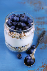 Healthy breakfast - yogurt with  blueberries and muesli served