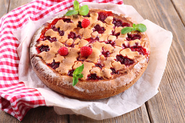 Tasty cake with berries on table close-up