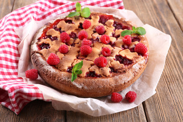 Tasty cake with berries on table close-up