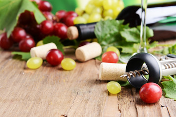 Wine bottle corks with grapes on table close-up