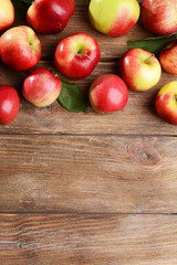 Sweet apples on wooden background